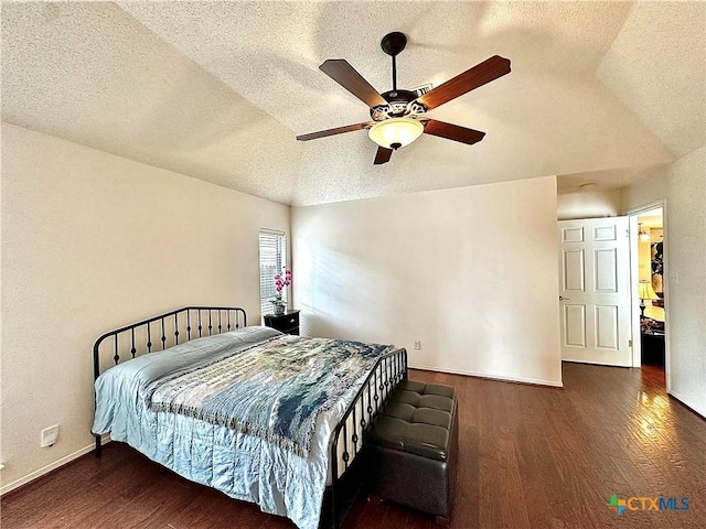 209 Westbrook Dr, Victoria, TX 77904 - bedroom featuring wood finished floors, a textured ceiling, lofted ceiling, and a ceiling fan