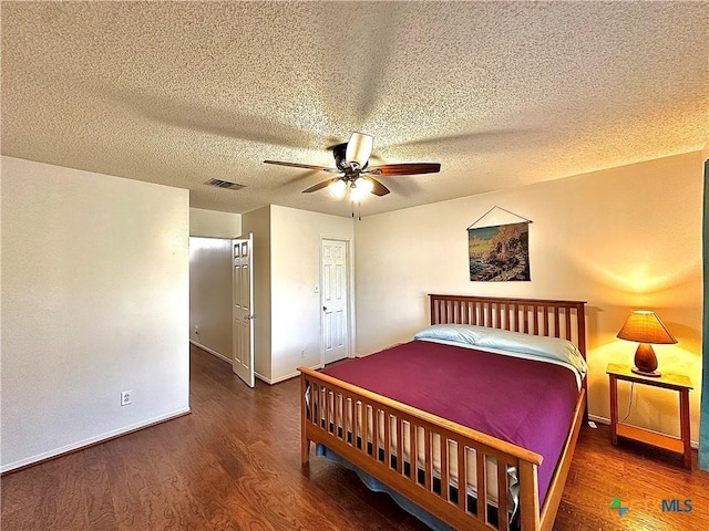 209 Westbrook Dr, Victoria, TX 77904 - bedroom featuring wood finished floors, ceiling fan, and a textured ceiling