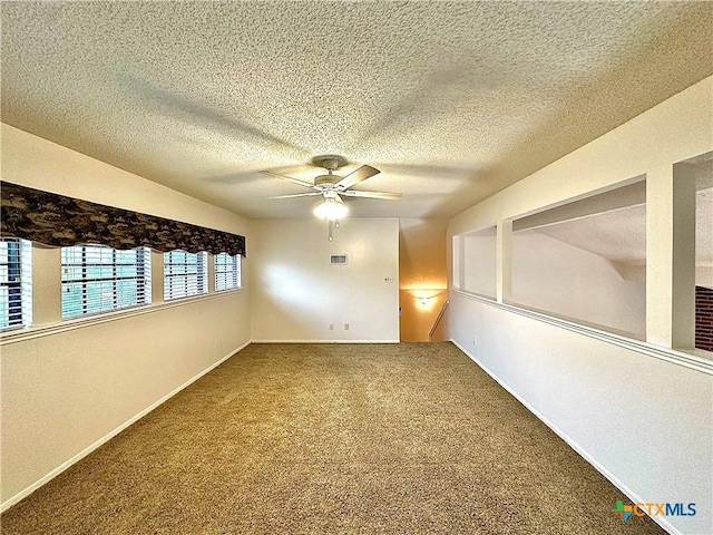 209 Westbrook Dr, Victoria, TX 77904 - carpeted empty room featuring ceiling fan and a textured ceiling