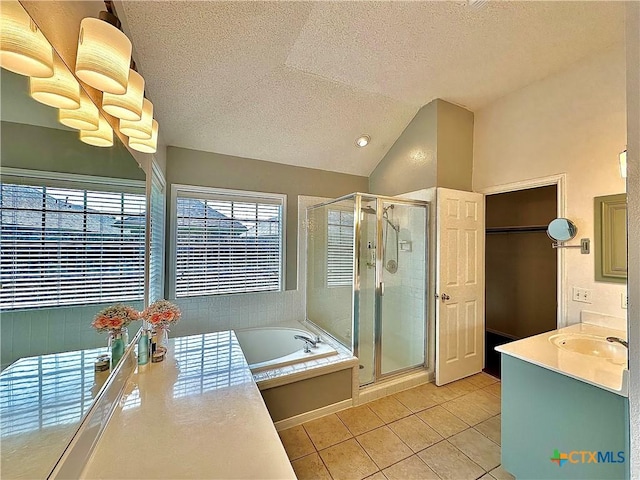 209 Westbrook Dr, Victoria, TX 77904 - bathroom with a textured ceiling, tile patterned floors, a shower stall, a bath, and vanity