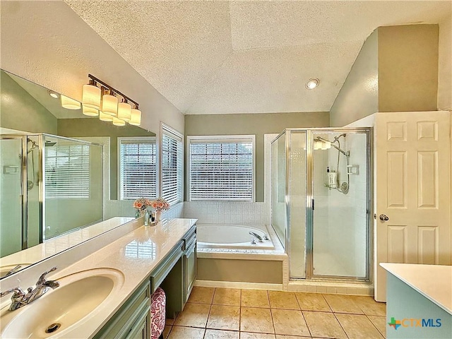 209 Westbrook Dr, Victoria, TX 77904 - full bath with vanity, a stall shower, tile patterned flooring, a textured ceiling, and a garden tub