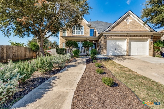 view of front of house with covered porch and a garage