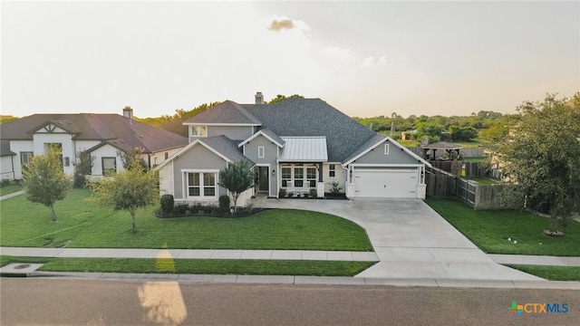 110 Terra Vista Ranch Rd, Victoria, TX 77904 - view of front of property with stucco siding, an attached garage, driveway, a standing seam roof, and a metal roof