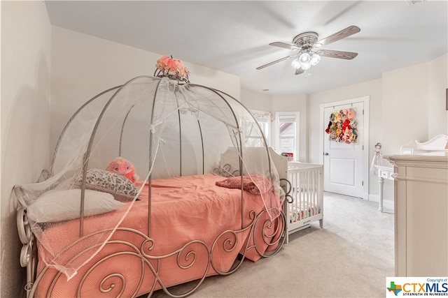 carpeted bedroom featuring ceiling fan