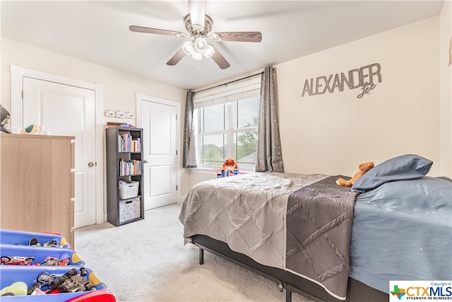 bedroom with light carpet and ceiling fan