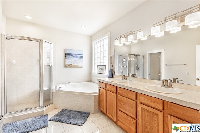 bathroom with vanity, tile patterned floors, and shower with separate bathtub