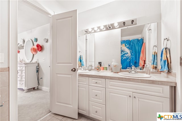 bathroom with vanity and tile patterned flooring