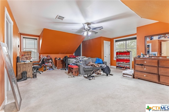 bedroom with vaulted ceiling, light carpet, and ceiling fan