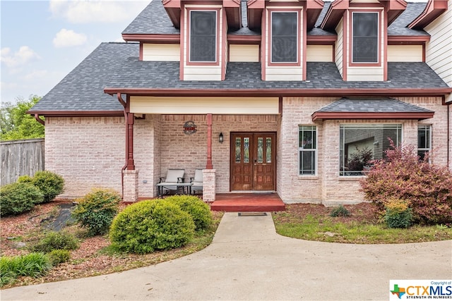 1402 Summer Glen Dr, Harker Heights, TX 76548 - doorway to property with a porch, a shingled roof, and brick siding