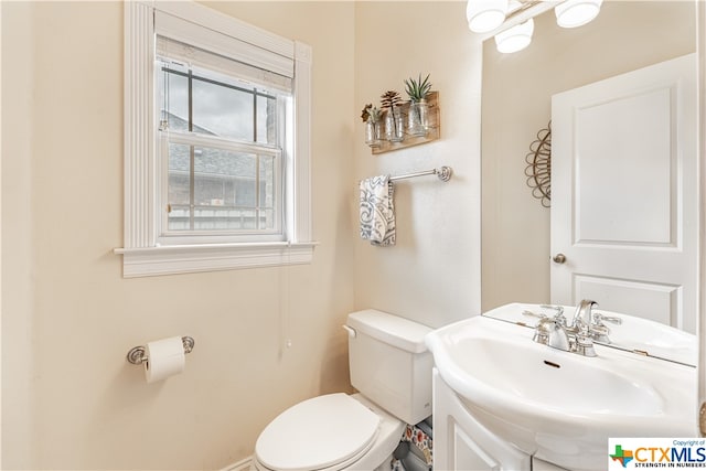 bathroom featuring toilet and sink