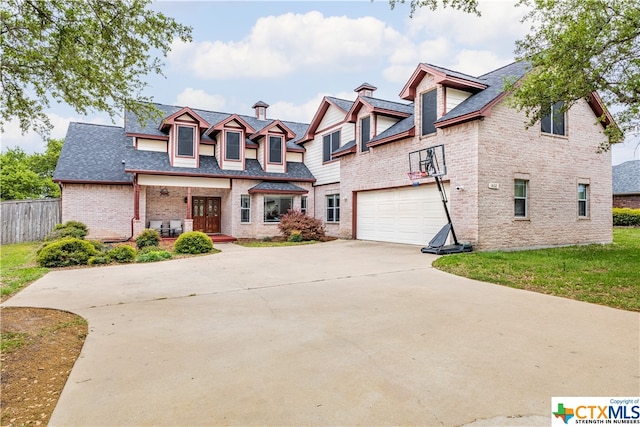 view of front facade featuring a garage and covered porch