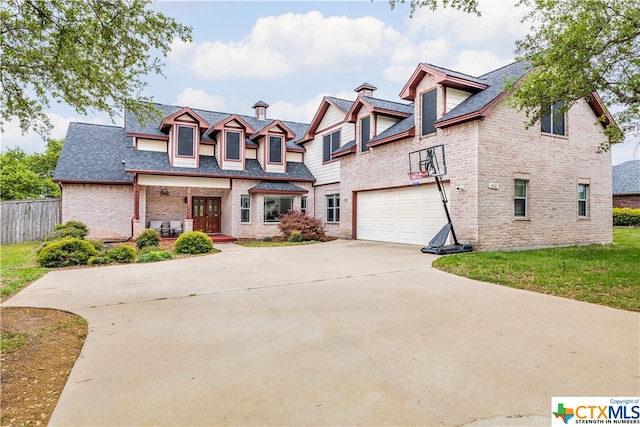 1402 Summer Glen Dr, Harker Heights, TX 76548 - view of front of house with a garage, concrete driveway, brick siding, and roof with shingles