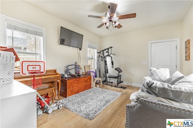 bedroom with light hardwood / wood-style floors and ceiling fan