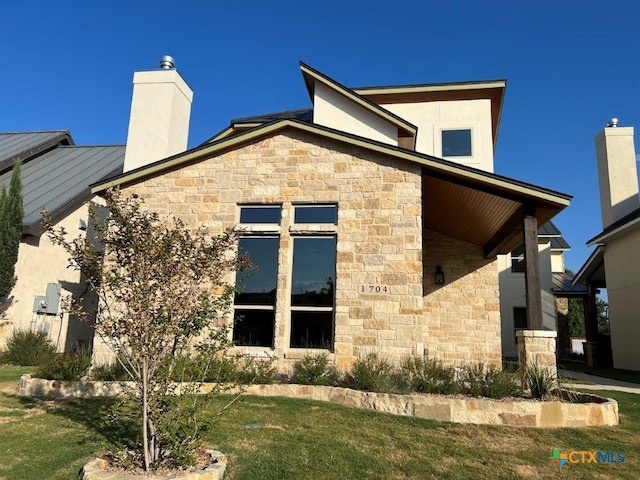 view of side of property with a yard