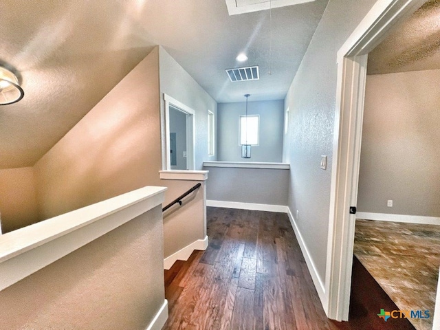 corridor featuring dark hardwood / wood-style floors