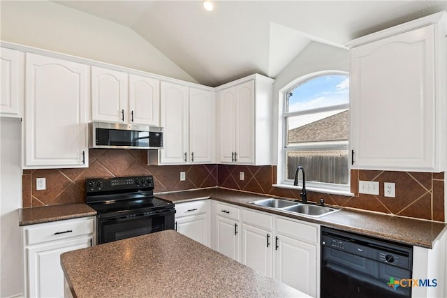 2010 Schorn Dr, Killeen, TX 76542 - kitchen with black appliances, dark countertops, vaulted ceiling, and white cabinetry