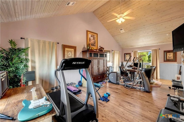 workout room with ceiling fan, light hardwood / wood-style flooring, high vaulted ceiling, and wood ceiling