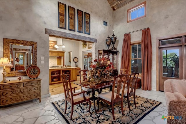 dining area with a high ceiling