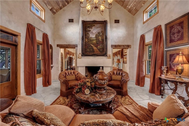 living area with high vaulted ceiling and a notable chandelier