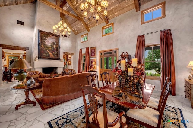 dining room with beam ceiling, high vaulted ceiling, and a chandelier