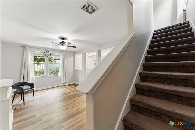 326 Trestle Tree, San Marcos, TX 78666 - staircase with wood finished floors, ceiling fan, and baseboards