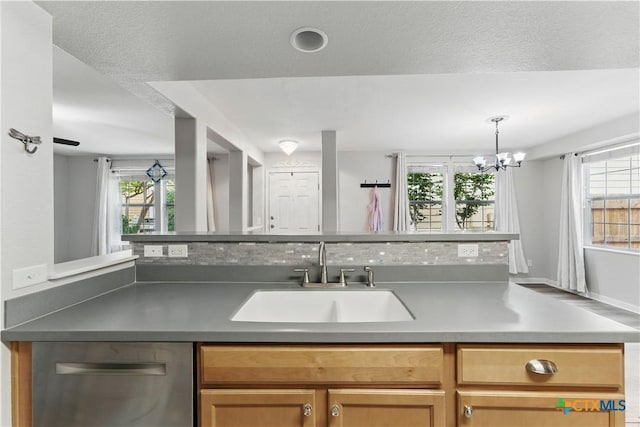 326 Trestle Tree, San Marcos, TX 78666 - kitchen featuring a sink, stainless steel dishwasher, a chandelier, and decorative light fixtures