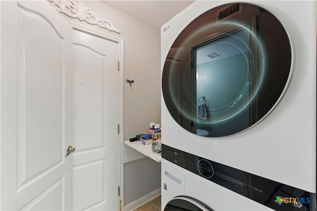 326 Trestle Tree, San Marcos, TX 78666 - laundry area featuring estacked washer and dryer and baseboards