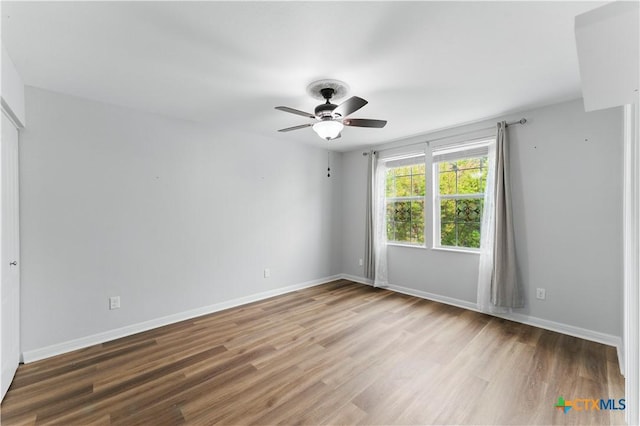326 Trestle Tree, San Marcos, TX 78666 - spare room with wood finished floors, ceiling fan, and baseboards