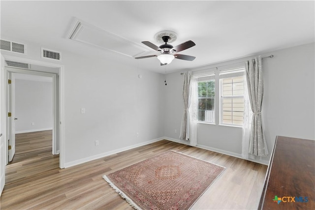 326 Trestle Tree, San Marcos, TX 78666 - unfurnished room featuring attic access, a ceiling fan, light wood-style flooring, and baseboards