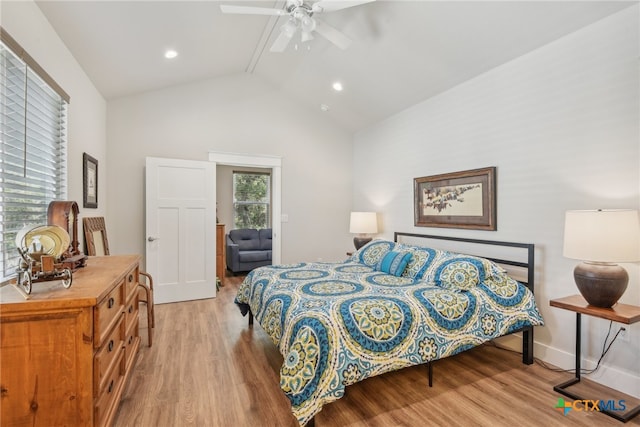 bedroom featuring light wood-type flooring, ceiling fan, and high vaulted ceiling