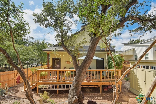 rear view of house with a wooden deck