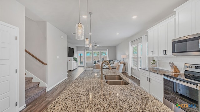 kitchen featuring white cabinetry, stainless steel appliances, sink, and dark hardwood / wood-style flooring