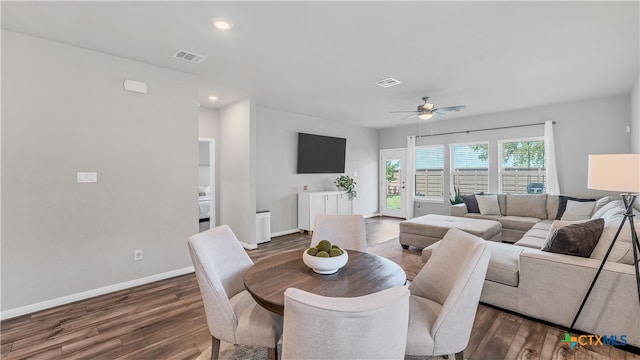 dining space featuring dark hardwood / wood-style flooring and ceiling fan