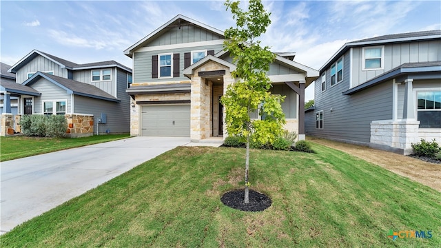 craftsman house with a garage and a front lawn