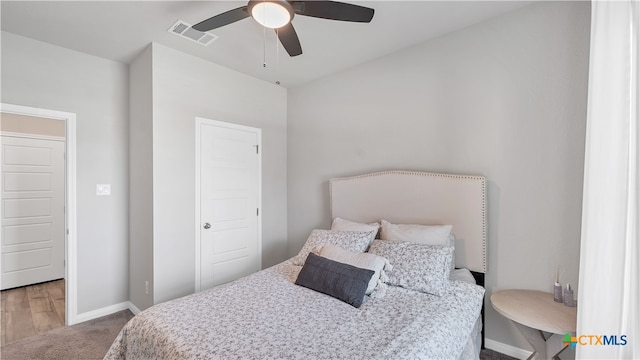 bedroom featuring ceiling fan and light hardwood / wood-style flooring