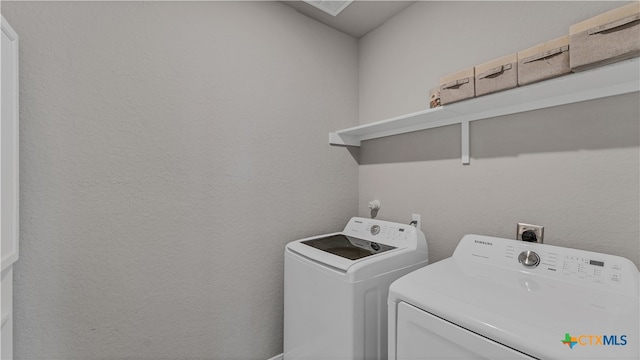 washroom featuring independent washer and dryer