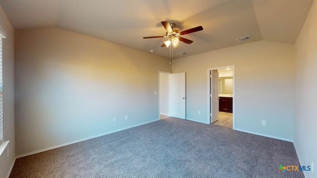 unfurnished bedroom with lofted ceiling, ensuite bath, light colored carpet, and ceiling fan