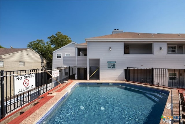 pool featuring fence