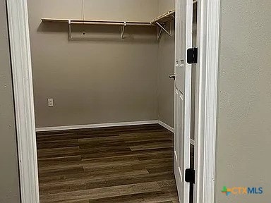 205 Lasalle Rd, Inez, TX 77968 - spacious closet with dark wood-style flooring