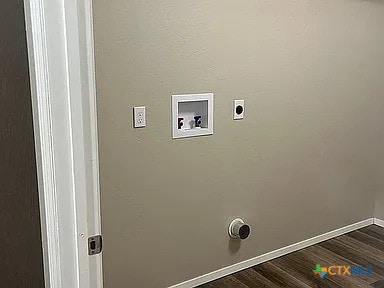 205 Lasalle Rd, Inez, TX 77968 - laundry room with dark wood-style flooring, washer hookup, baseboards, and electric dryer hookup