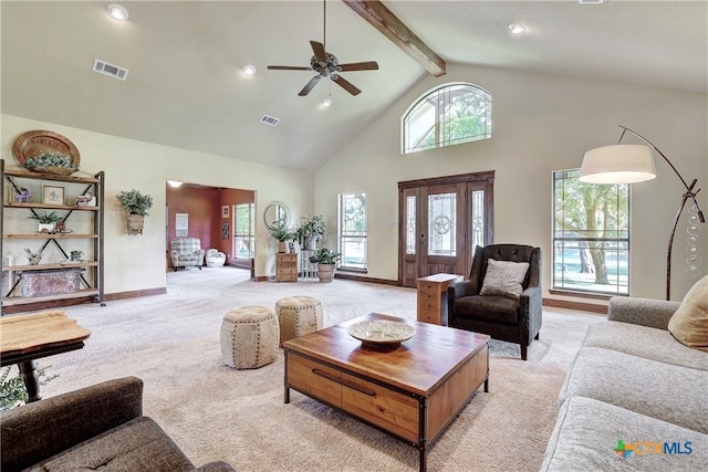 carpeted living room with high vaulted ceiling, ceiling fan, and beam ceiling