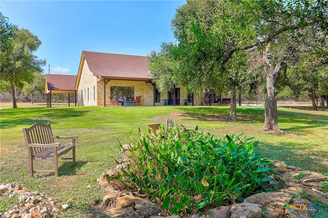 view of property's community with a yard