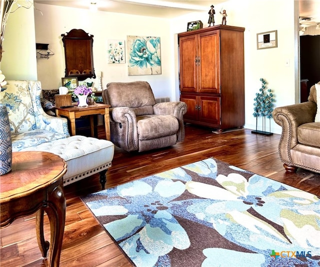 living room with dark hardwood / wood-style floors