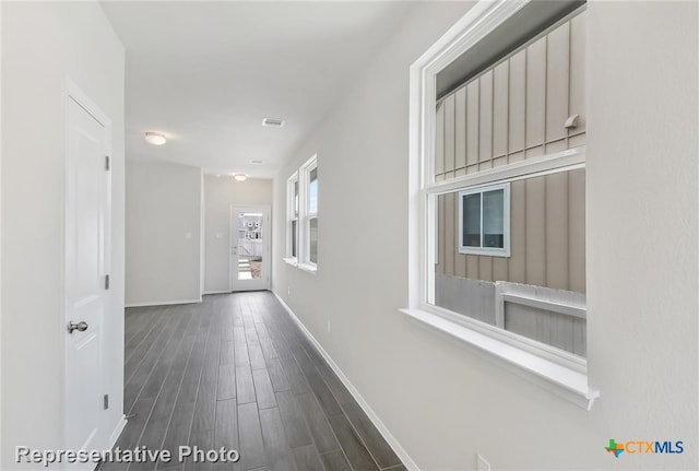 corridor featuring dark hardwood / wood-style flooring