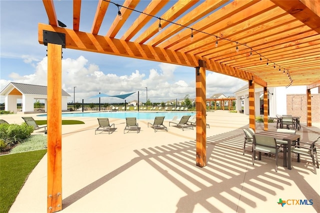 view of patio / terrace with a pergola and a community pool