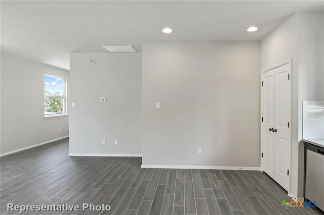 unfurnished room featuring dark hardwood / wood-style flooring