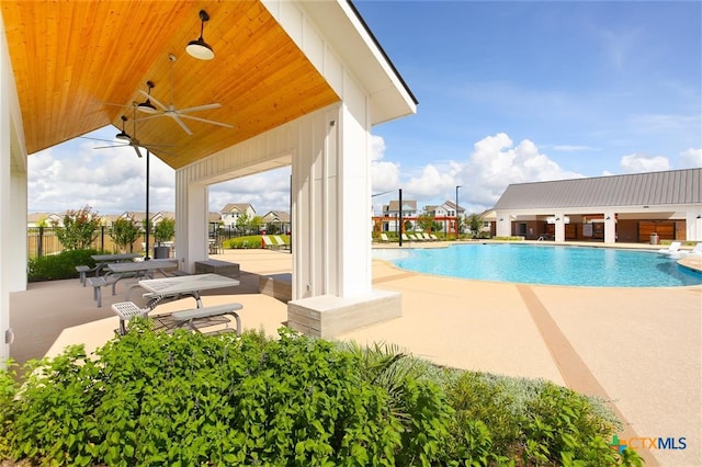 view of swimming pool with a patio area and ceiling fan