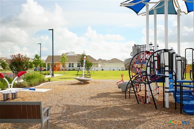 view of playground featuring a lawn