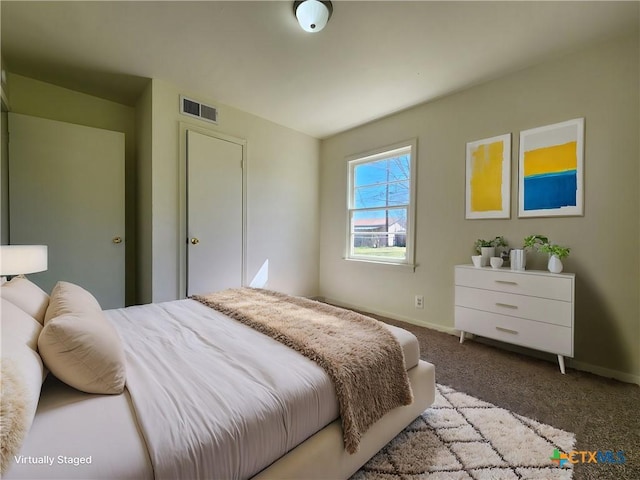 bedroom with visible vents, carpet flooring, and baseboards