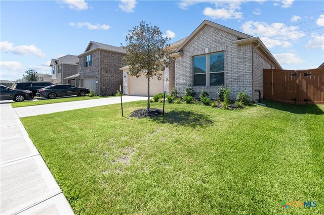 7703 Coral Key Dr, Northwest Harris, TX 77433 - view of front of house with driveway, brick siding, and a garage